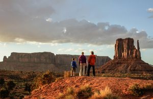 A family standing in Monument Valley