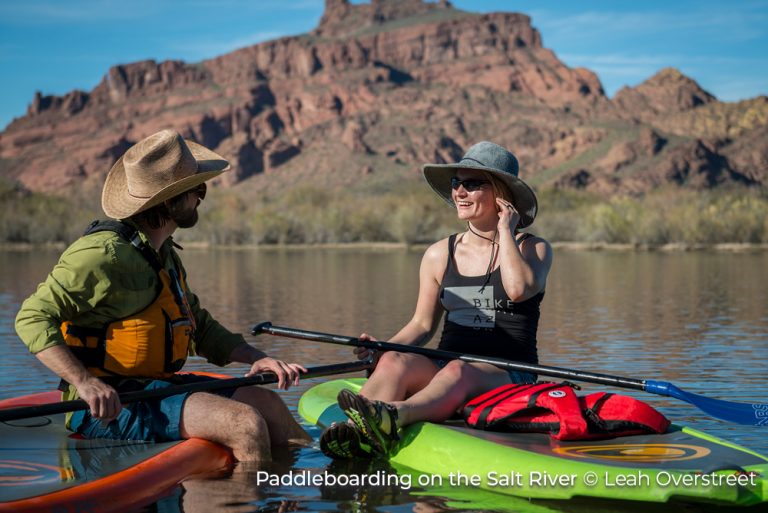Two people paddleboarding on the Salt River in Phoenix, Arizona. There's room to explore in Phoenix Arizona.