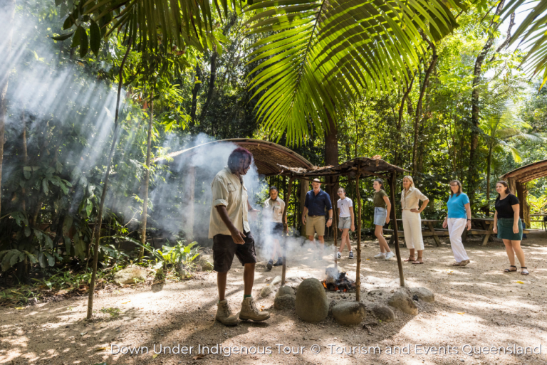 Indigenous guide, Skip, leading guests through a traditional smoking ceremony - part of the Dreamtime Walk at Mossman Gorge