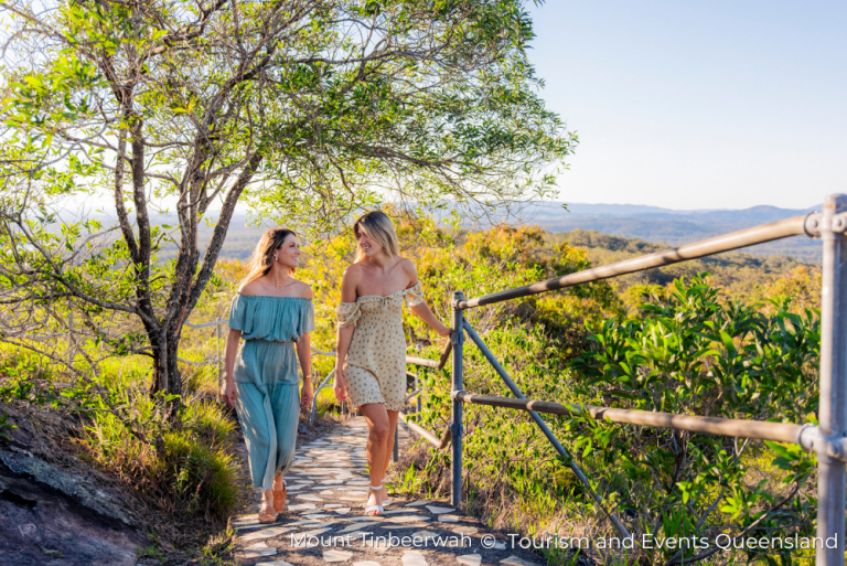 a couple walking along a path on Mount Tinbeerwah, Queensland