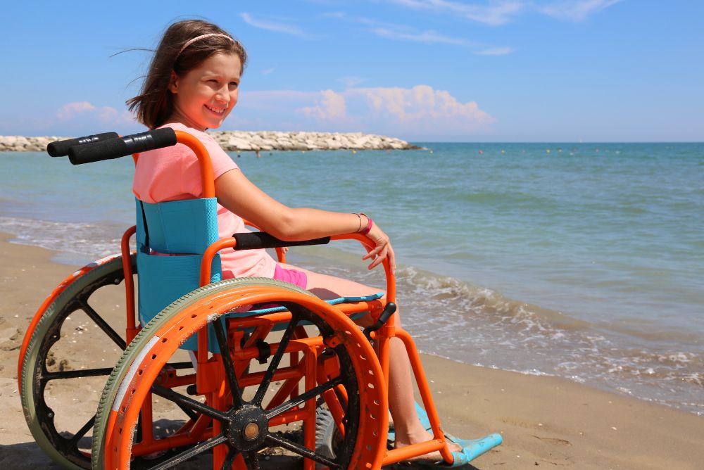 Lizzi Luxury Edit Accessible travel girl wheel chair beach access 08Feb23