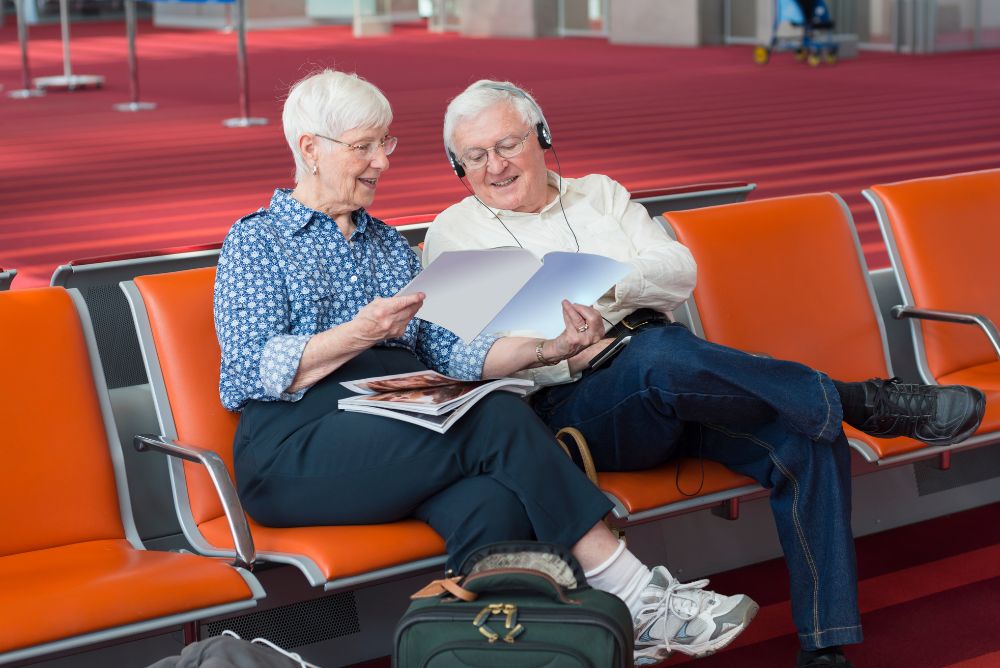 Lizzi's luxury edit_ Luxury travel options for older travellers Elderly couple sitting doen 27Apr23