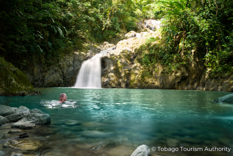 Waterfall with woman swimming Sustainable Tobago 15Jul23